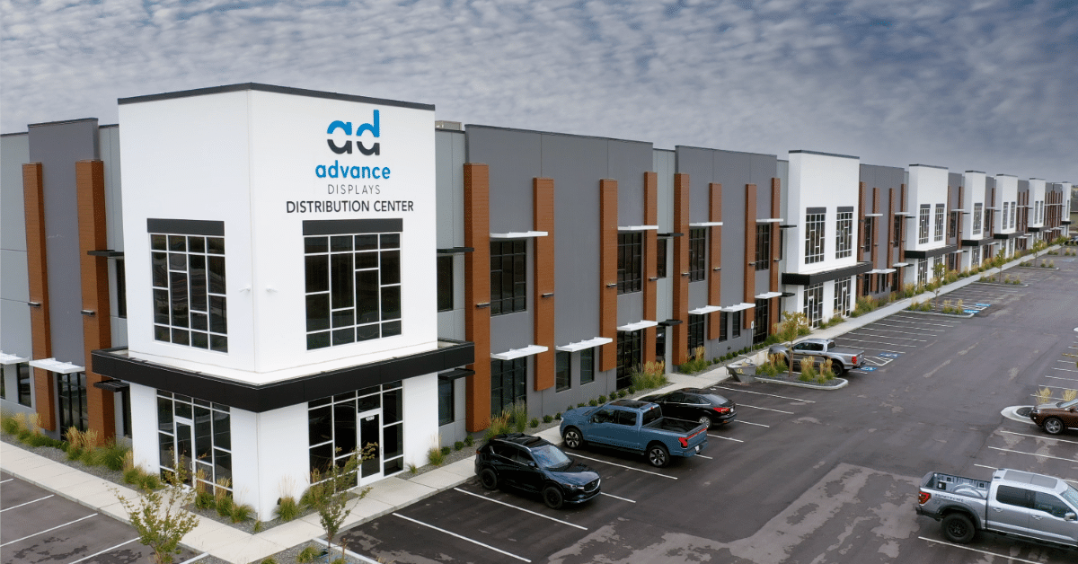 Happy retail business owner receiving a product shipment with satisfaction guarantee.